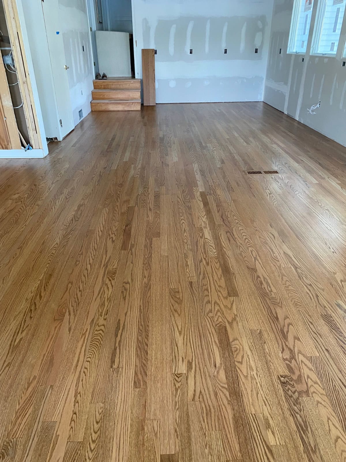 Custom-stained red oak hardwood floors refinished by Patrick Daigle Hardwood Flooring near Lake Pocotopaug in East Hampton, CT 06424.