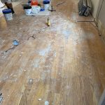 Existing oak hardwood floor during home renovation before repairs and refinishing in Bolton CT.