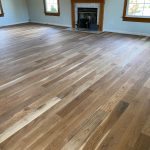 Wide-width character white oak flooring installed in an Enfield CT 06082 home with a light stain and matte oil-based polyurethane finish