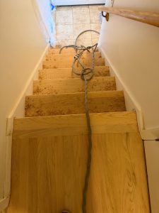 Hardwood stairs sanded to raw wood during a hardwood floor refinishing project in Newington CT 06111