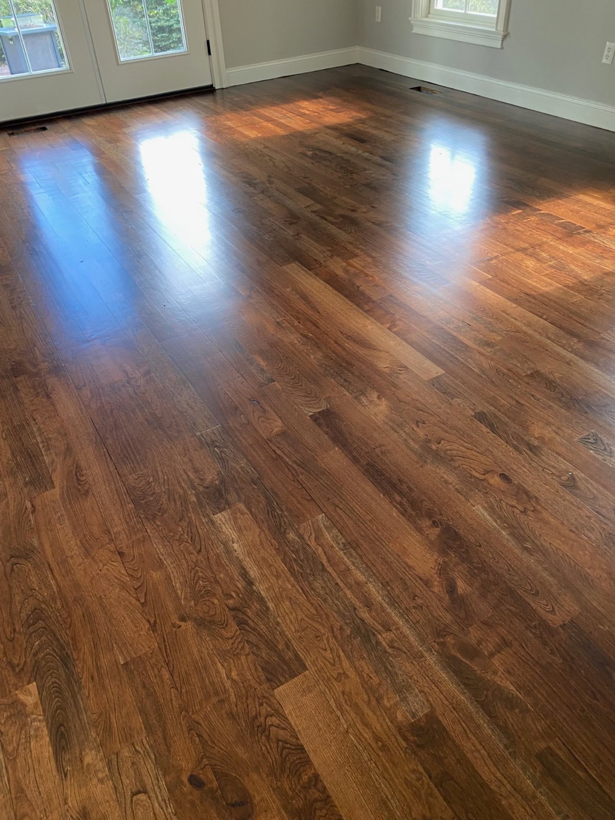 Custom stain samples applied directly to a hardwood floor during a Tolland CT 06084 hardwood floor refinishing project