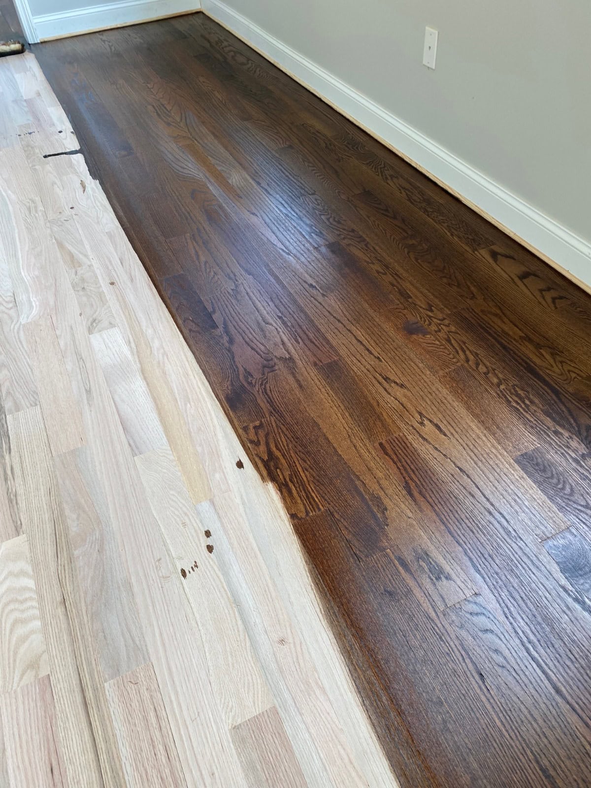 Custom stain being applied to freshly sanded white oak during hardwood floor refinishing in Tolland CT 06084